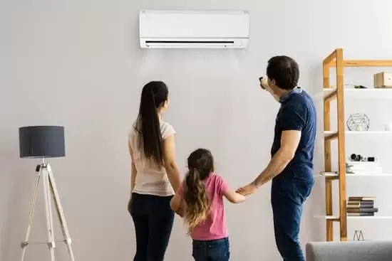 Internal residential wall mounted air conditioning unit woman , man and child 